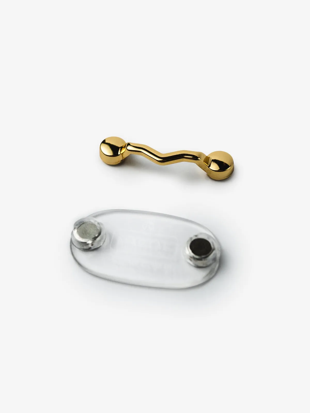 Peça frontal e base do MagTag Classic Ouro, separadas, em ângulo