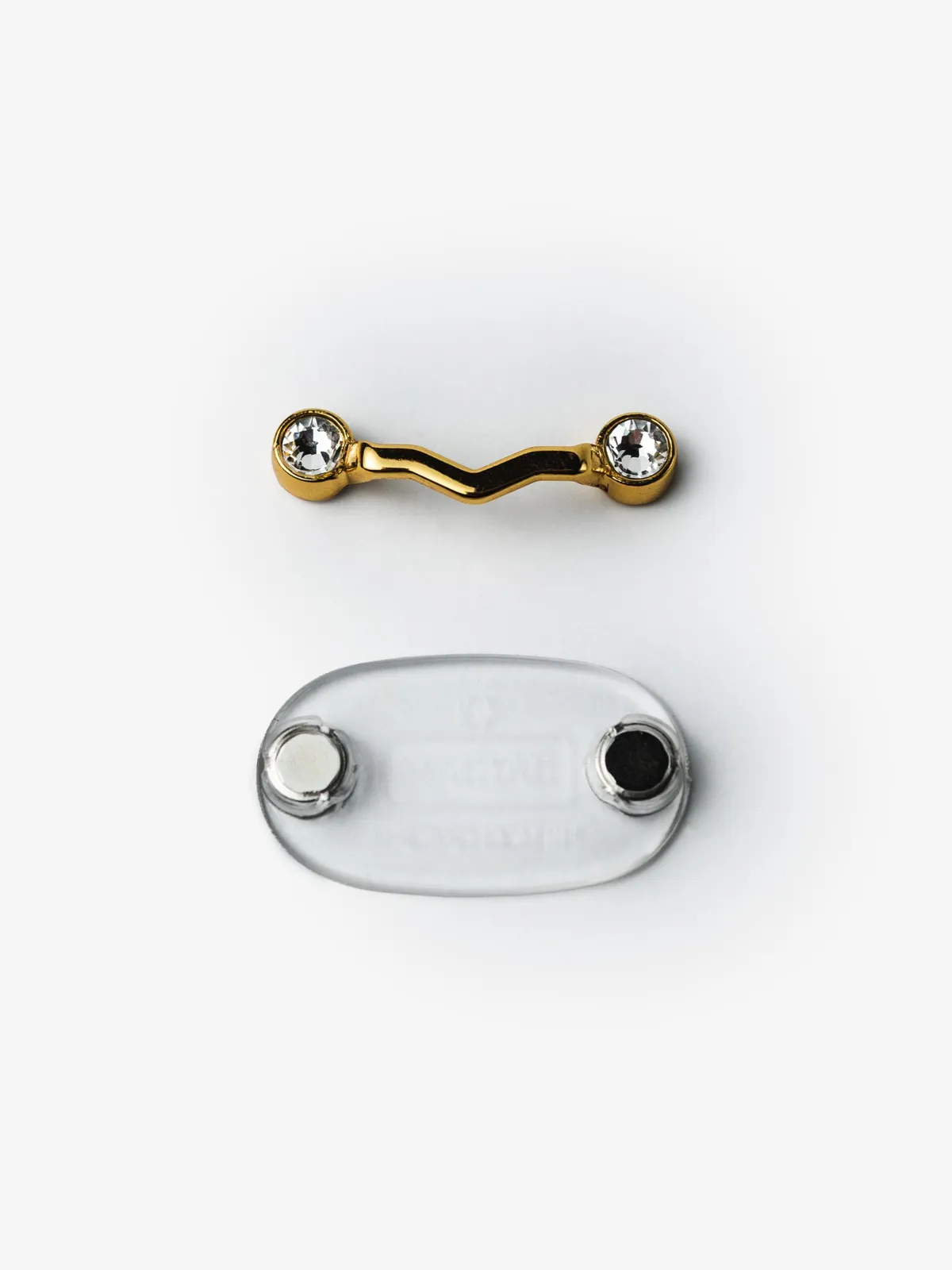 Peça frontal e base translúcida do MagTag Lux Ouro, separadas