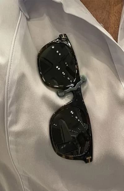 Clip-on sunglasses held on a shirt with MagTag Sport