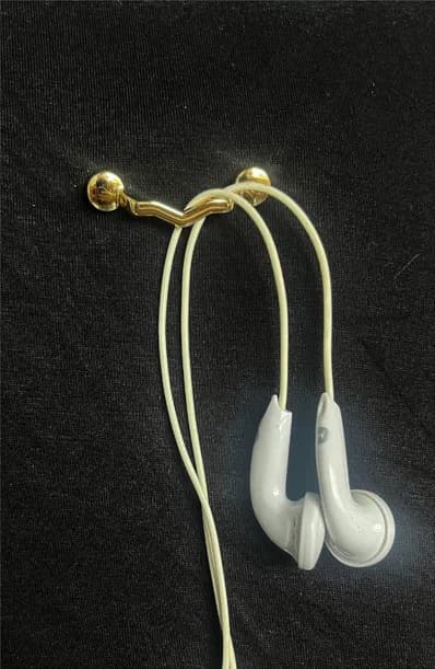 Wired earphones hanging from MagTag