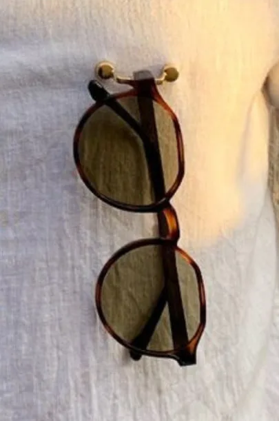 Prescription glasses held on a blouse with MagTag